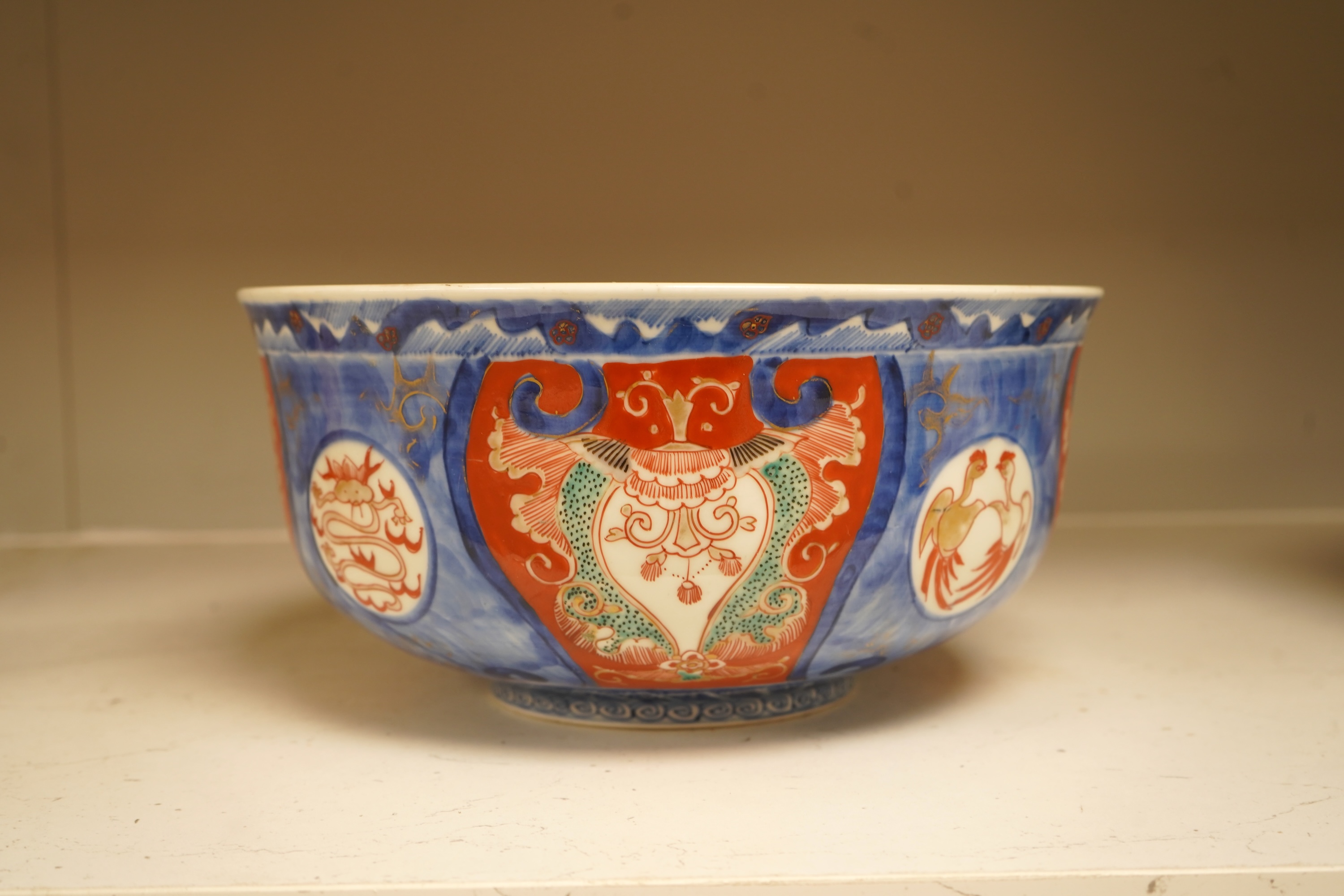 A Japanese Imari bowl and a similar fluted dish, bowl 25cm diameter